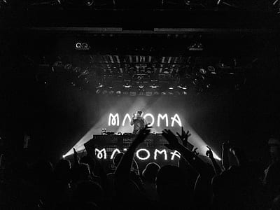 DJ standing on stage thumbnail