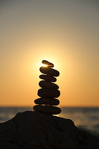 silhouette photography of stone balancing thumbnail