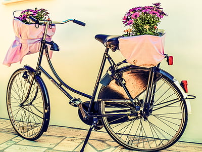black beach cruiser bicycle near white wall thumbnail