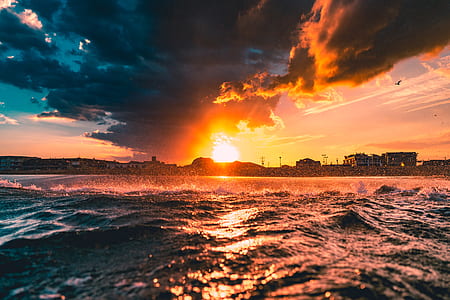 body of water waving during sunset thumbnail