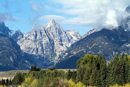 mountains under white clouds during daytime thumbnail