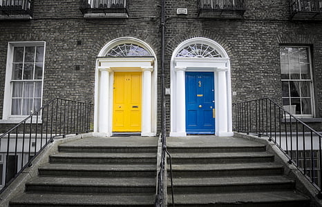 two yellow and blue doors closed at daytime thumbnail
