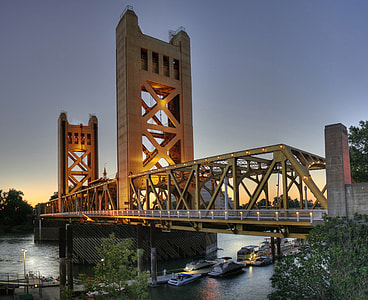 boats crossing under the bridge thumbnail