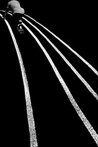 grayscale photography of man on racetrack thumbnail
