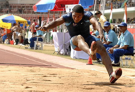 man in black shirt jumping on sand thumbnail