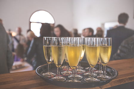 clear champagne flutes on tray thumbnail