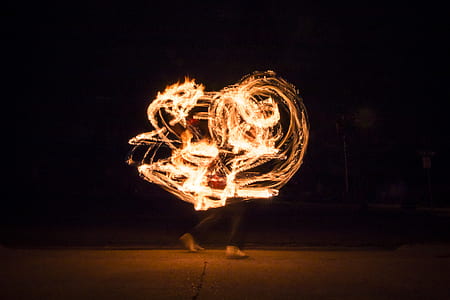 timelapse photography of a person performing fire art thumbnail