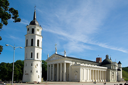 white concrete cathedral under blue skies daytime thumbnail
