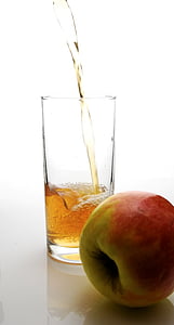 red apple beside clear drinking glass thumbnail