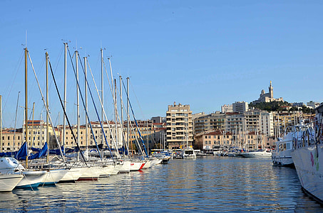white boats on body of water during daytime thumbnail