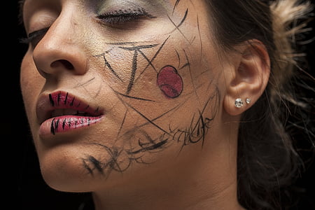 woman with pink lipstick taking close-up selfie thumbnail