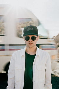 man wearing white dress shirt and black hippie sunglasses thumbnail