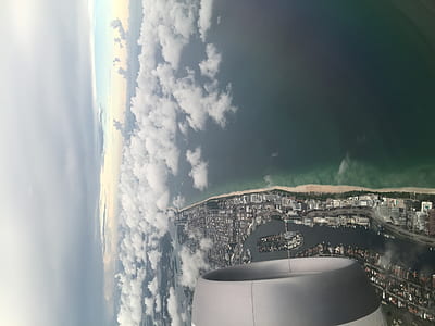 aerial view from airplane of villages surrounded by water thumbnail