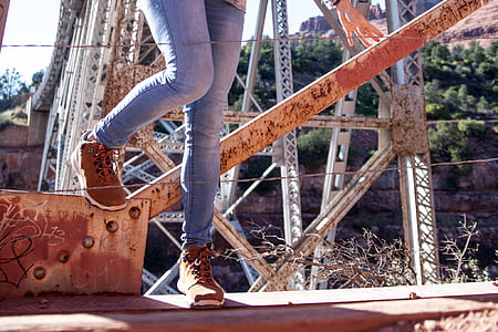 person standing near brown metal bar thumbnail