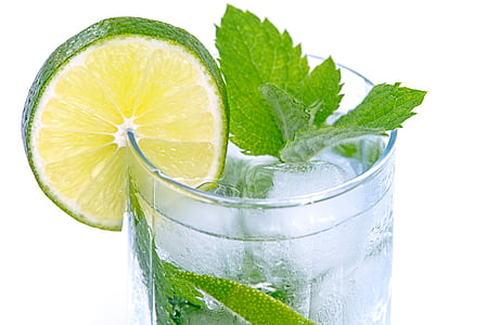 green leaf and sliced lime on clear glass drinking cup thumbnail