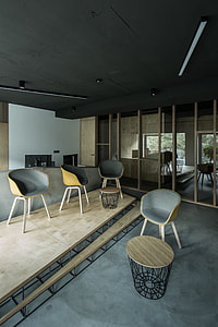 four brown and white wooden tub chairs and two tables thumbnail