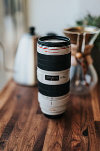 selective focus photography of white and black Ultrasonic camera lens on table thumbnail