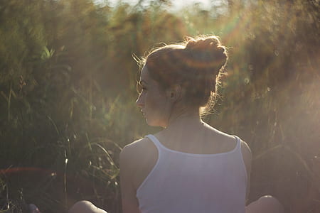 woman sitting beside green grass thumbnail