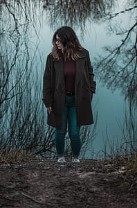 woman standing under tree thumbnail