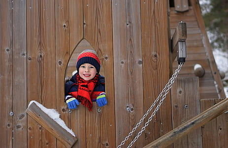 toddler's standing near wooden wall thumbnail