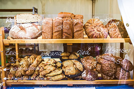Brown Wooden Rack With Baked Bread Displayed thumbnail