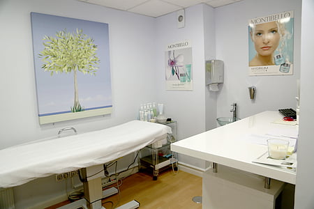 white dentist table beside wall thumbnail