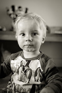 grayscale and selective focus photo of baby thumbnail