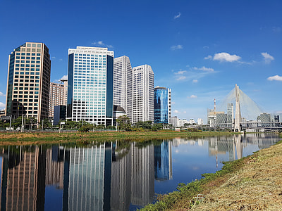 high rise buildings near body of water thumbnail