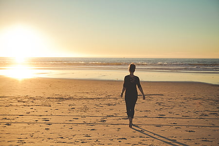 woman walking on shoreline thumbnail