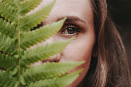 shallow focus photography of woman's face thumbnail