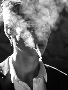 male smoking grayscale photo thumbnail