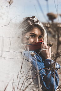 woman covering her face using red scarf thumbnail