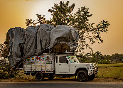 white skate truck on road under brown sky thumbnail