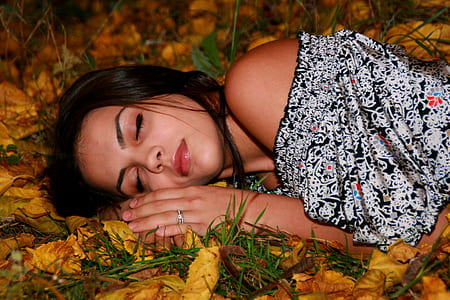 woman lying on yellow leaves thumbnail