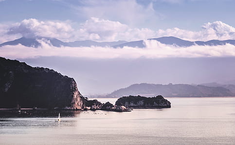 mountain near body of water thumbnail