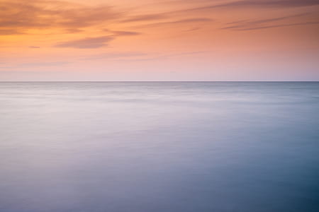 body of water during sunset thumbnail