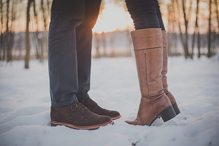 two persons standing on snow-covered ground thumbnail