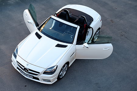 white Mercedes-Benz convertible with opened doors outdoors thumbnail