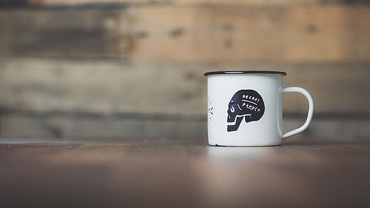 white and black skull-printed mug thumbnail
