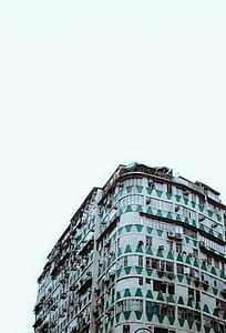 white and green concrete building at daytime thumbnail