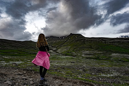 woman wearing black long-sleeved shirt looking at hill thumbnail