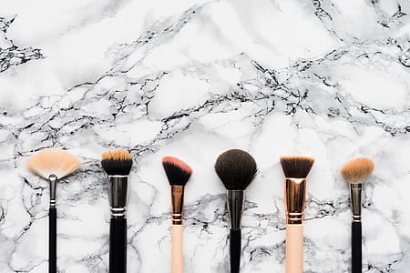 Makeup Brushes on White Marble Background thumbnail