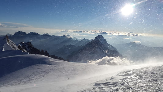photo of snow mountains during daytime thumbnail