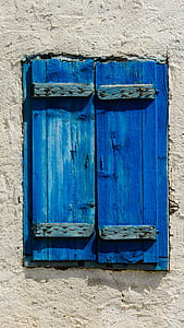 sunlight over closed blue wooden windows thumbnail