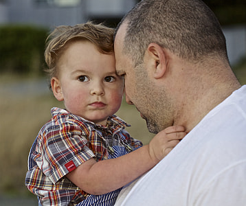 man carrying toddler thumbnail
