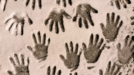 black hand prints on beige pad thumbnail