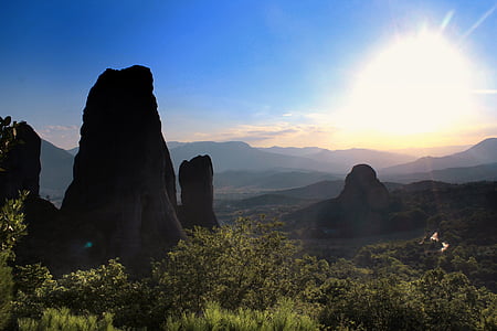 brown rock formation under blue sky during daytime thumbnail