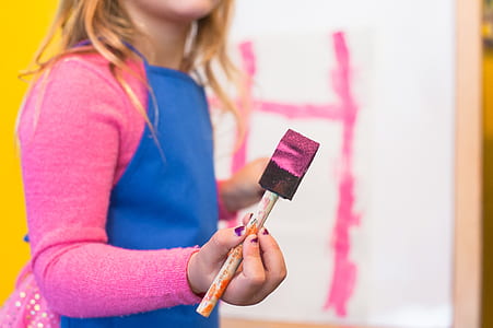girl painting of white canvas thumbnail
