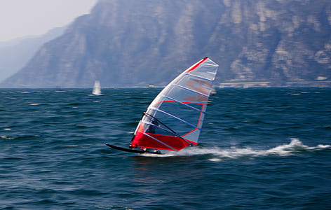 person windsurfing in body of water thumbnail