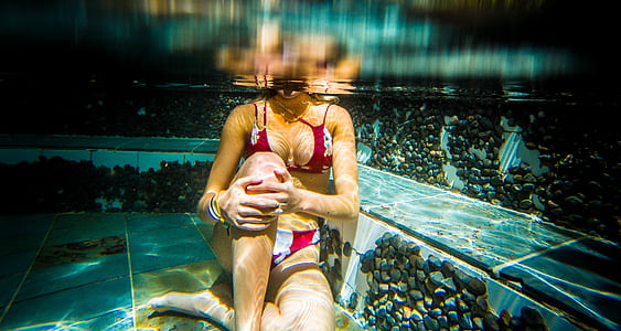 woman sitting under water thumbnail